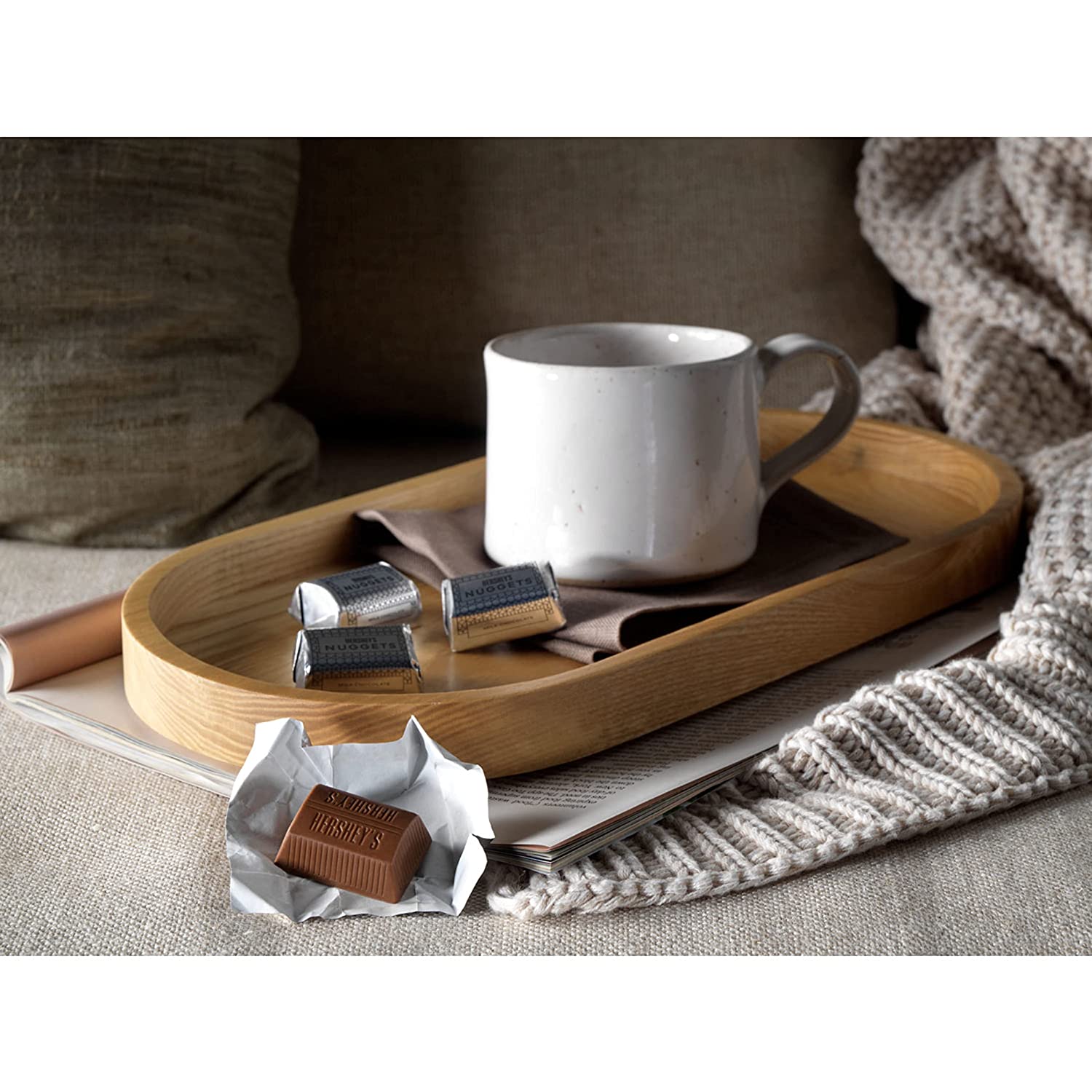 A tray with a cup of coffee and a Hershey's Nuggets Milk Chocolate Bag 289g.