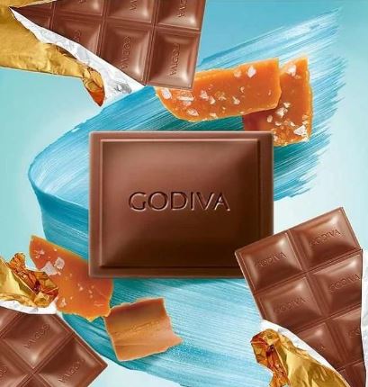 Godiva Milk Salted Caramel Bar 90g on a blue background.