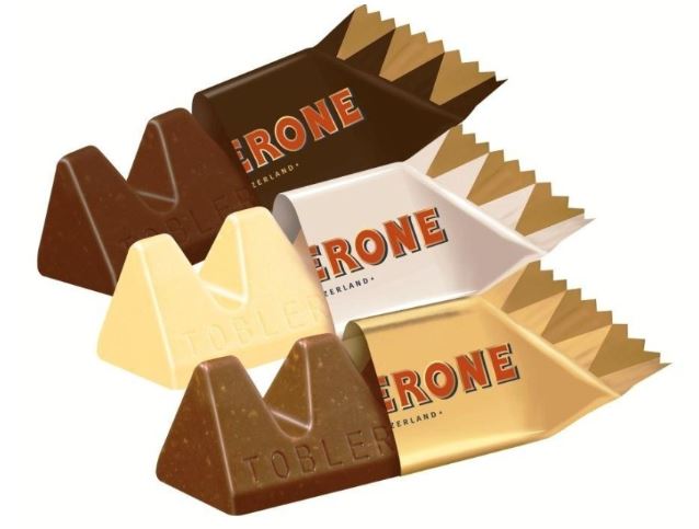 Four Toblerone Tiny Mix Bag 272g with the word torne on them.