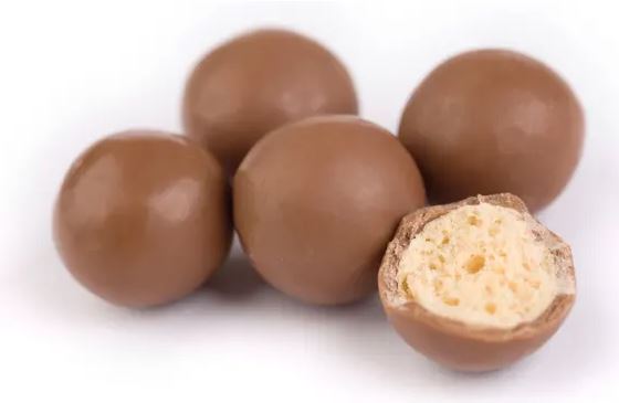 A group of Malteser 255g chocolate eggs on a white background.