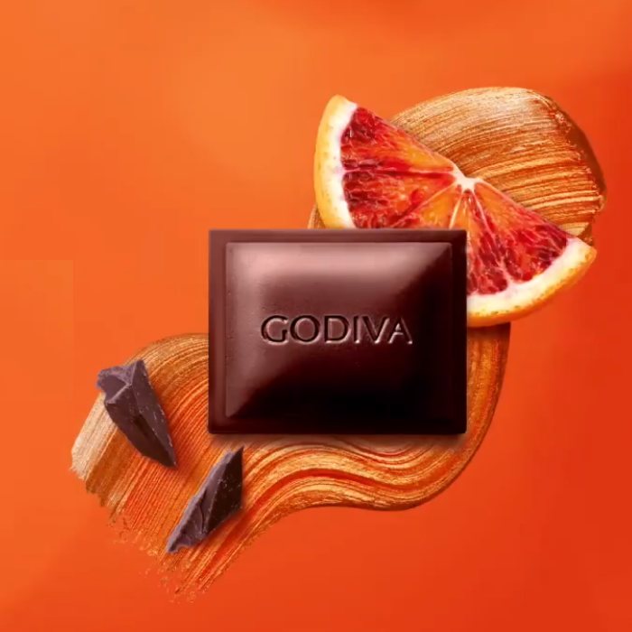 A Godiva Dark Blood Orange Bar 90g with orange slices and the word godiva.