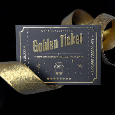A Golden Ticket by Gift Cards on a black background.