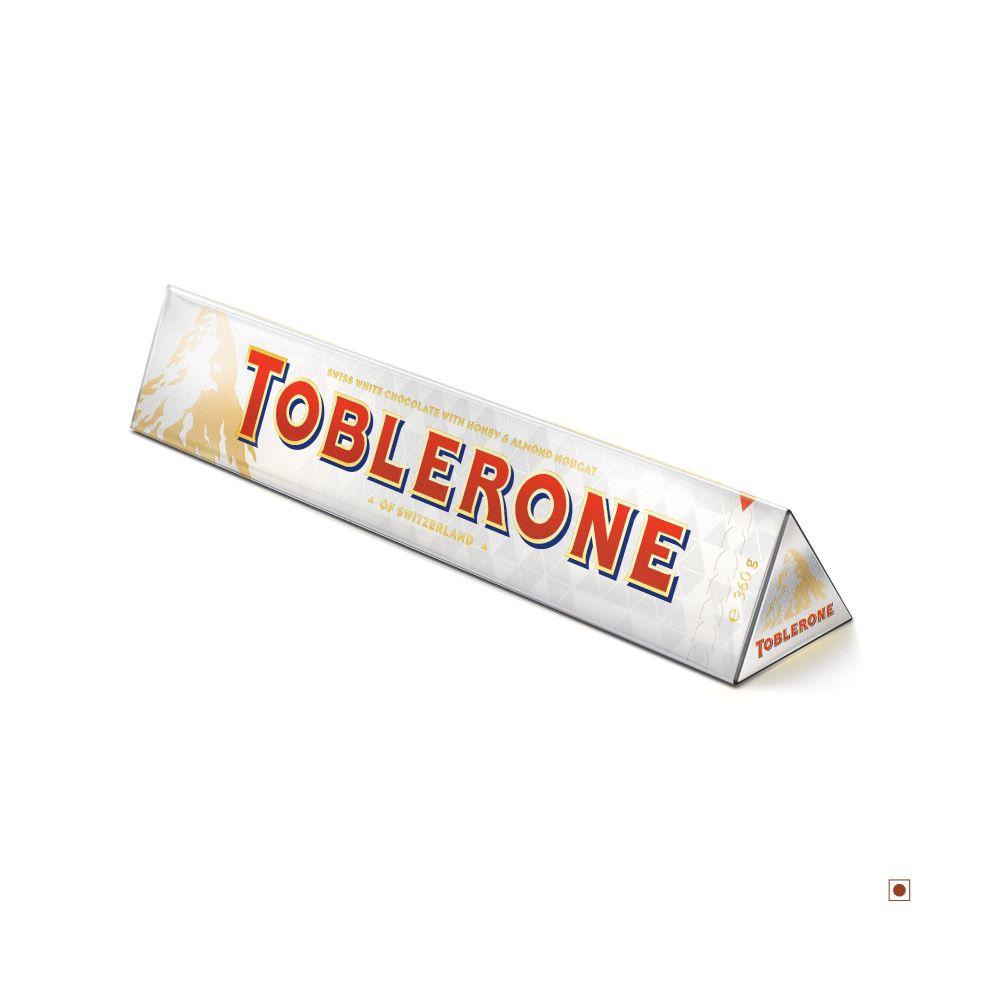 A Toblerone White Bar 360g in distinctive triangular packaging, featuring the word "TOBLERONE" in red and yellow letters, with a delicious blend of honey and almond nougat.