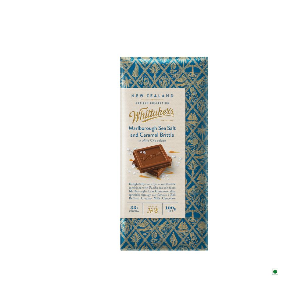 A Whittakers Marlborough Sea Salt & Caramel Bar 100g from New Zealand with a pattern on it, flavored with Marlborough Sea Salt & Caramel Brittle.